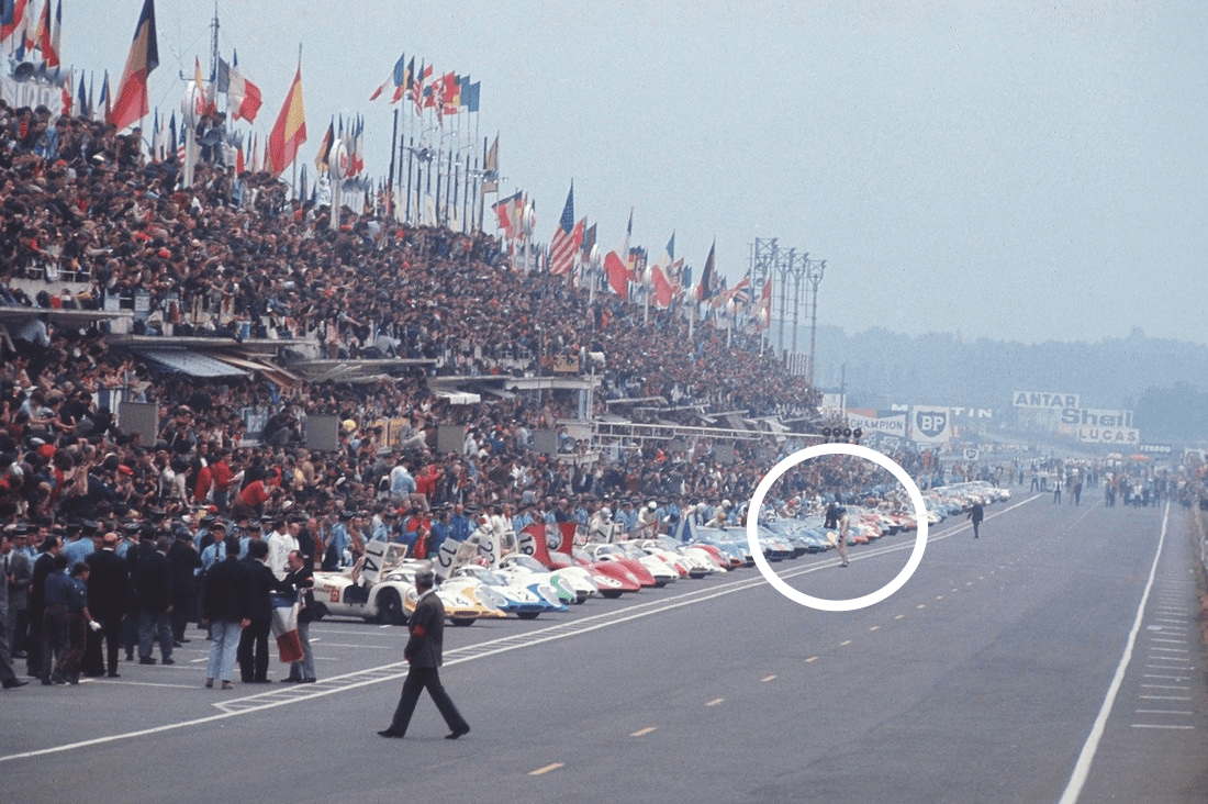 Jacky Ickx walking across the track at the start of the 1969 24 Hours of Le Mans
